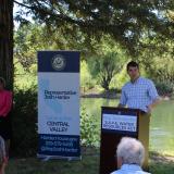 warehouse manager shaking hands with warehouse worker