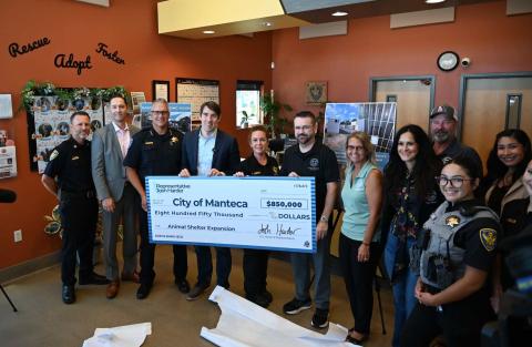 Josh Harder presenting check to Manteca Animal Shelter