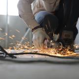 construction worker using a saw